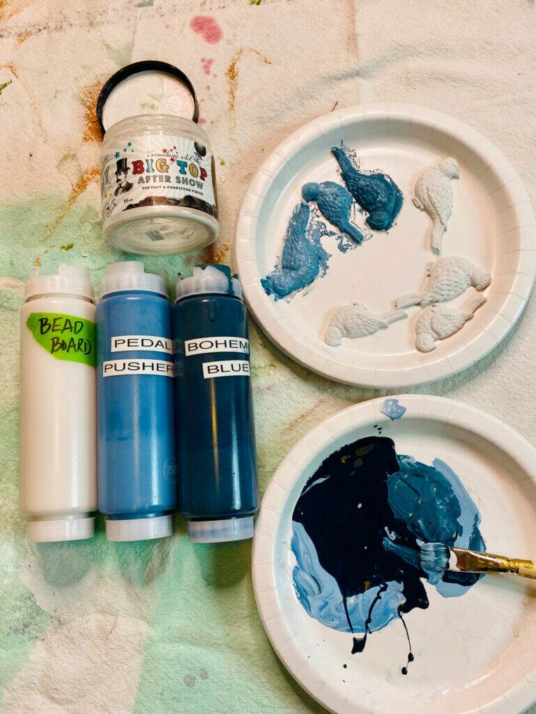 Mixing paint colors for a blended look.