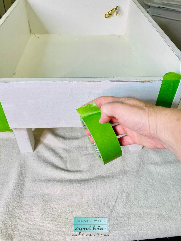 Using frog tape on the painted pet bed.