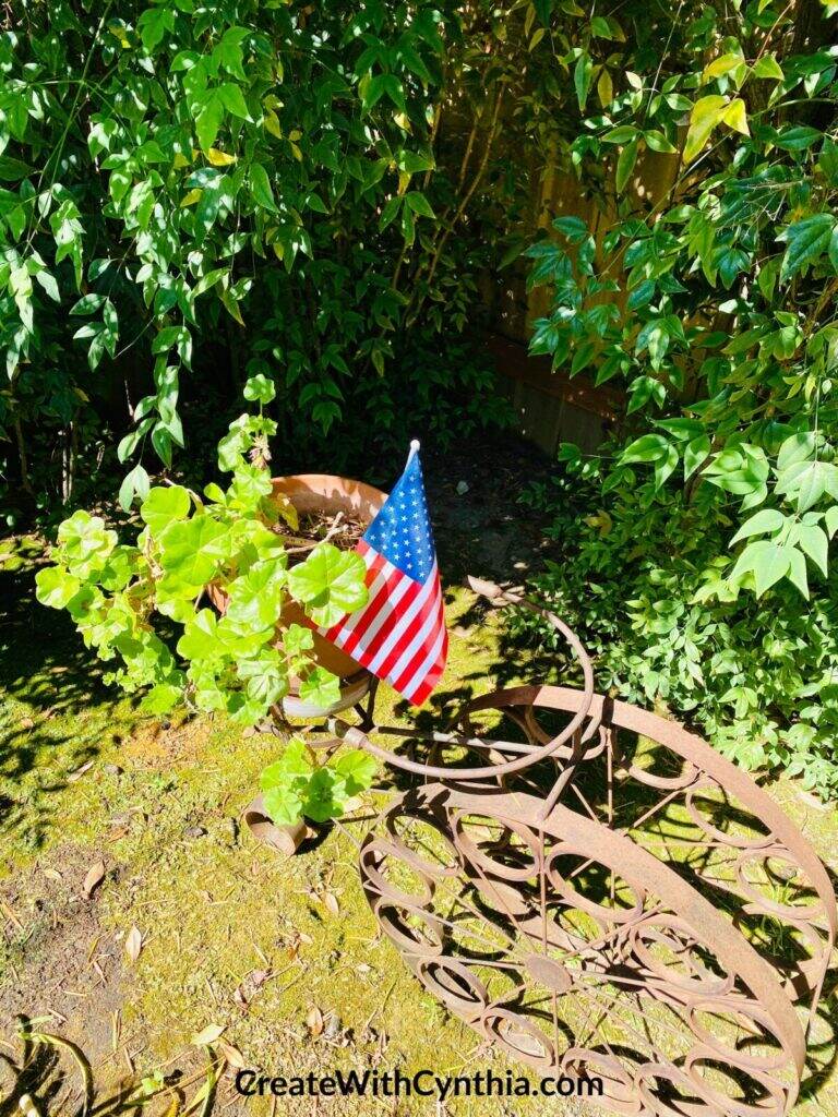 Bicycle in the garden celebrating red, white and blue.