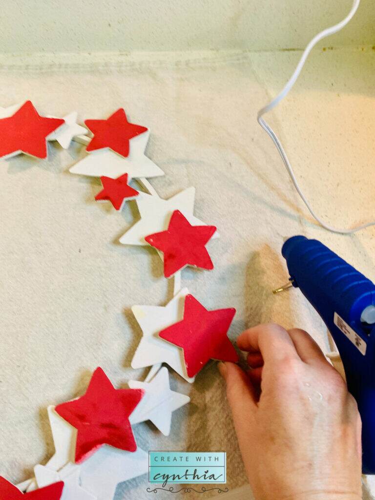 Gluing the stars on the star wreath.