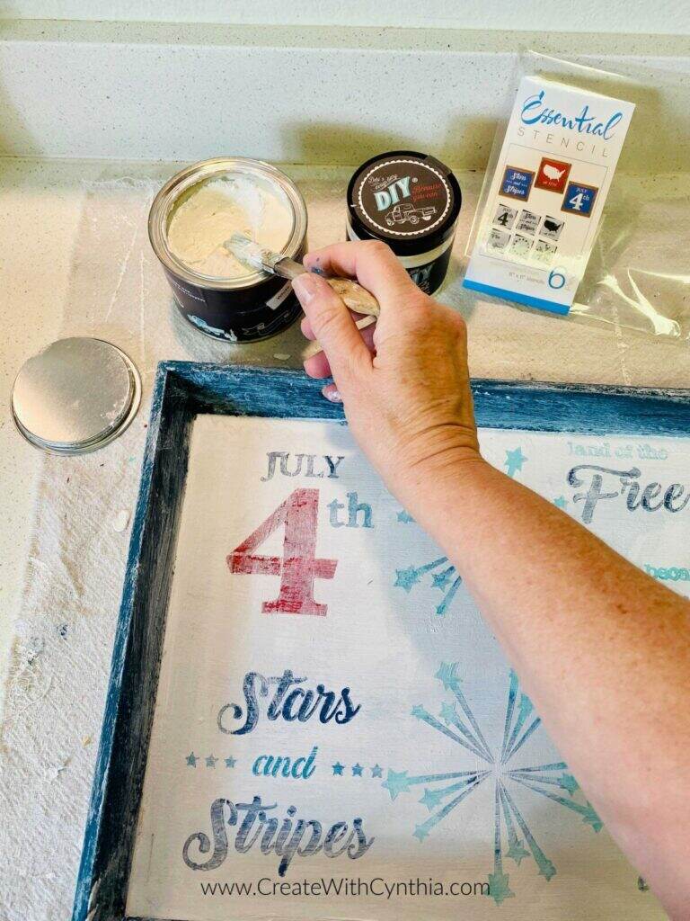 Adding wax to the patriotic serving tray