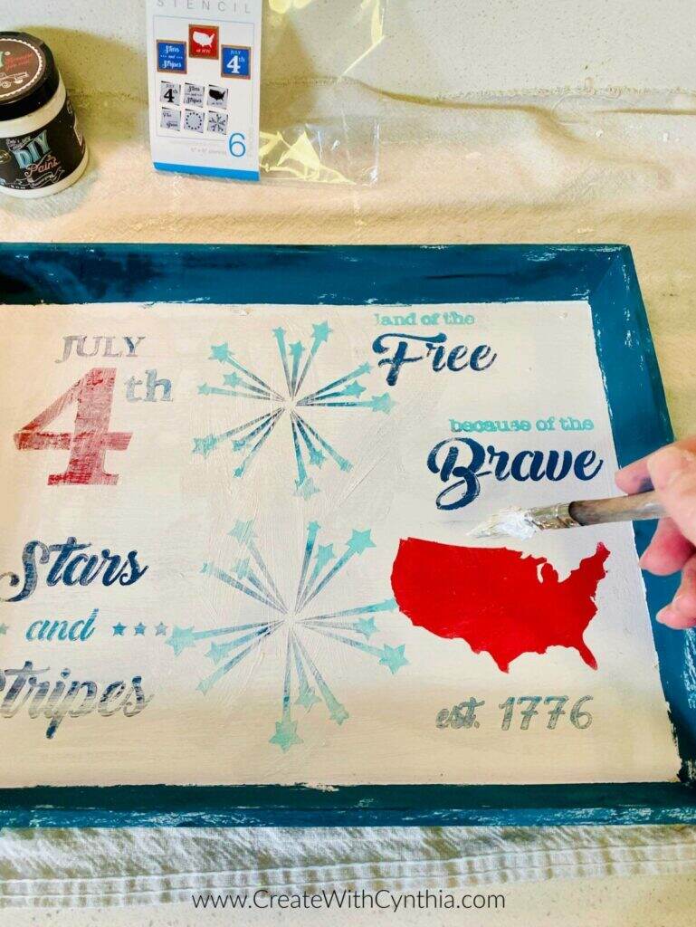 Adding wax to the patriotic serving tray